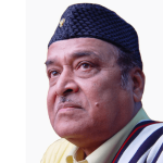 A portrait of Bhupen Hazarika wearing a traditional Assamese hat and attire, looking thoughtful. He was a legendary singer, composer, and poet from Assam.