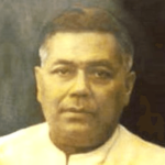 A historical portrait of Gopinath Bordoloi, Assam’s first Chief Minister and a prominent freedom fighter who shaped Assam’s political and cultural future.