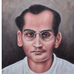 A portrait of Jyoti Prasad Agarwala, a renowned Assamese poet, playwright, filmmaker, and freedom fighter, wearing glasses and traditional attire.