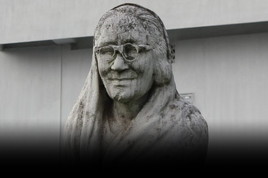Nalini Bala Devi: The Inspiring Voice of Assamese Literature Parveen Hooda A weathered stone bust of Nalini Bala Devi, an iconic Assamese poet and writer, wearing glasses and a veil.
