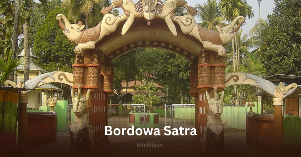 Intricately designed entrance gate of Bordowa Satra, featuring traditional Assamese sculptures of mythical creatures, symbolizing the rich heritage of the Vaishnavite monastery in Assam.
