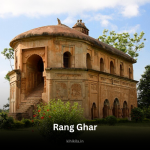 An ancient two-story structure made of red bricks with arched entrances and a curved roof, known as Rang Ghar, an iconic historical monument in Assam.