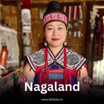 Naga woman in traditional tribal dress inside a cultural hut