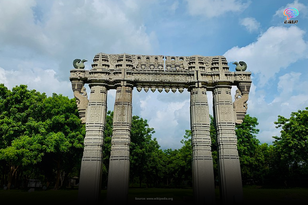 Ornate stone Torana gateway in Telangana with intricate carvings and sculptures