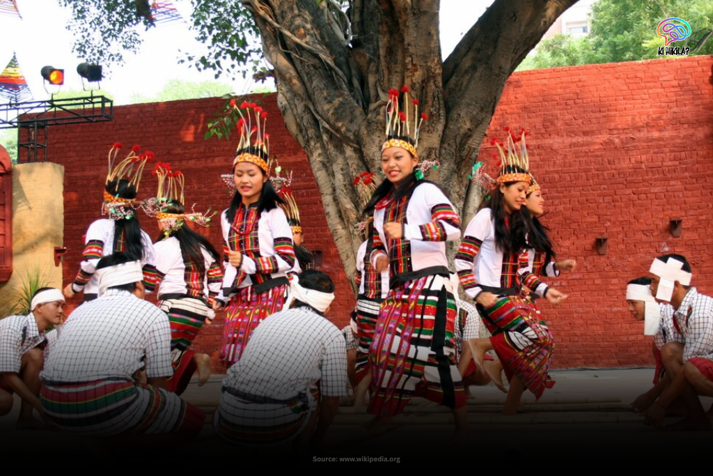 Traditional Cheraw dance performance by Mizo men and women in colorful attire.