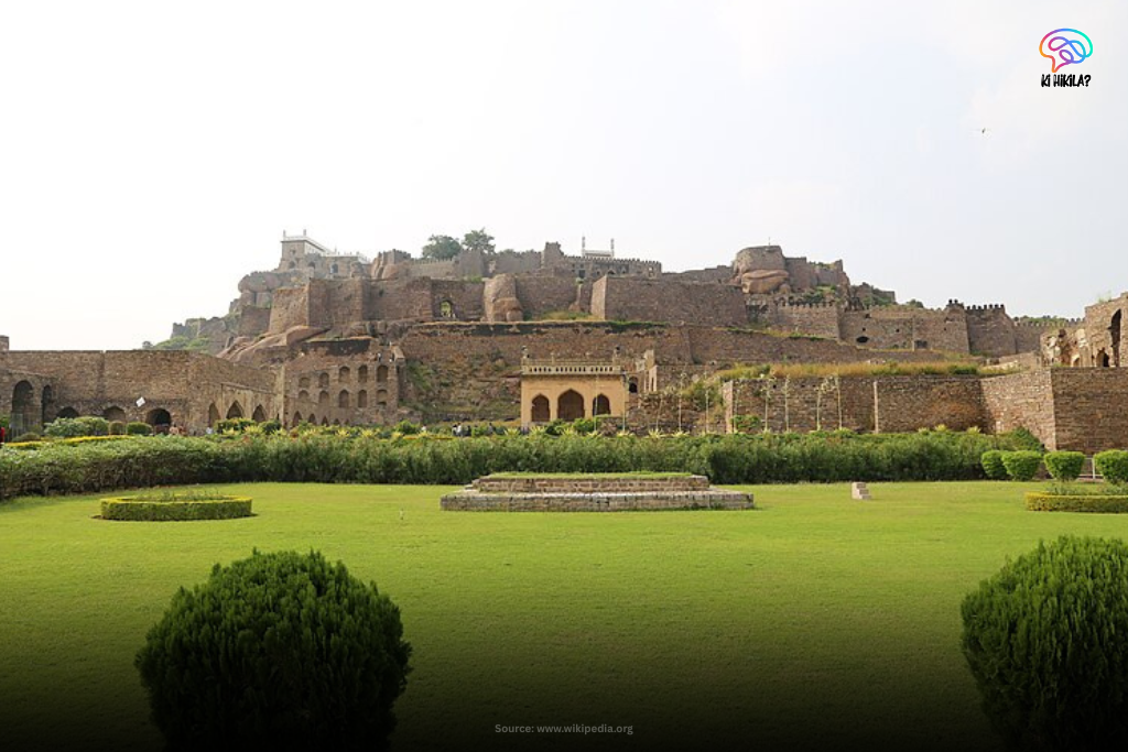 Wide-angle view of the historic Golconda Fort surrounded by green gardens in Telangana