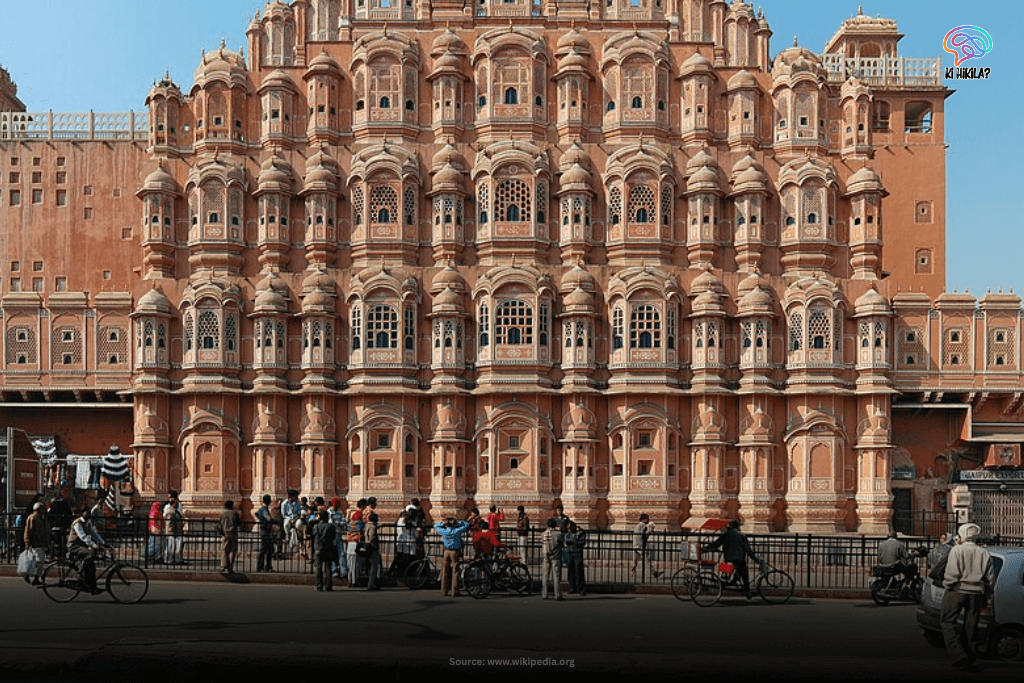 Rajasthan State Guide: Majestic Forts, Rich Heritage, and Key Facts for Students and Curious Minds The intricate pink sandstone facade of Hawa Mahal, the Palace of Winds, in Jaipur, Rajasthan, with people and vehicles in front.