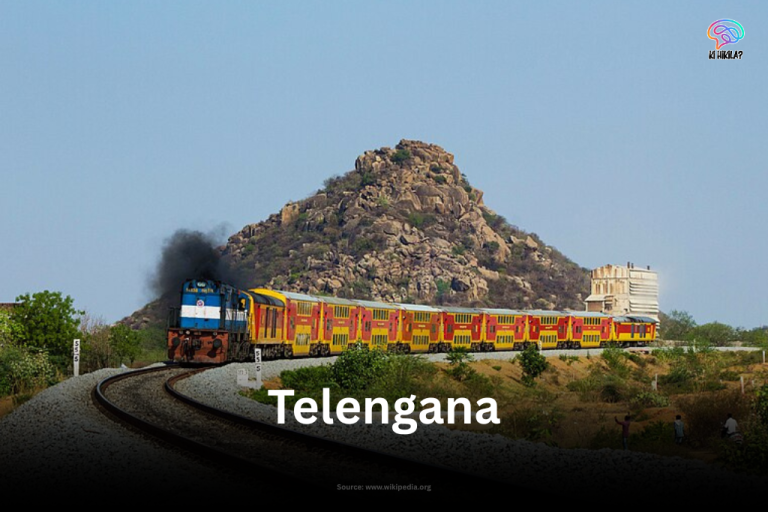 Kacheguda AC Double Decker Express train passing through rocky landscape in Telangana