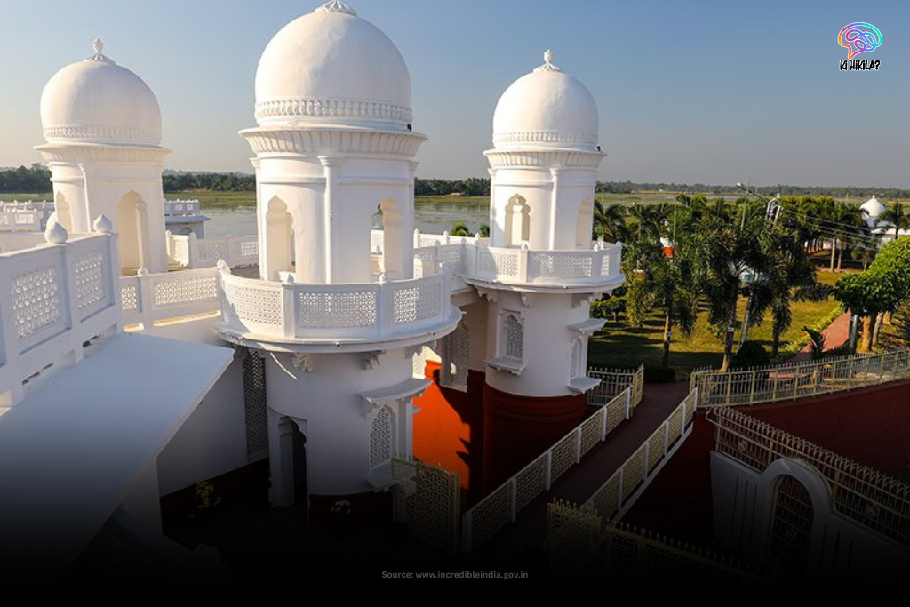 A view from the white, domed rooftop of Neermahal palace, looking out over Rudrasagar Lake in Tripura on a clear day.
