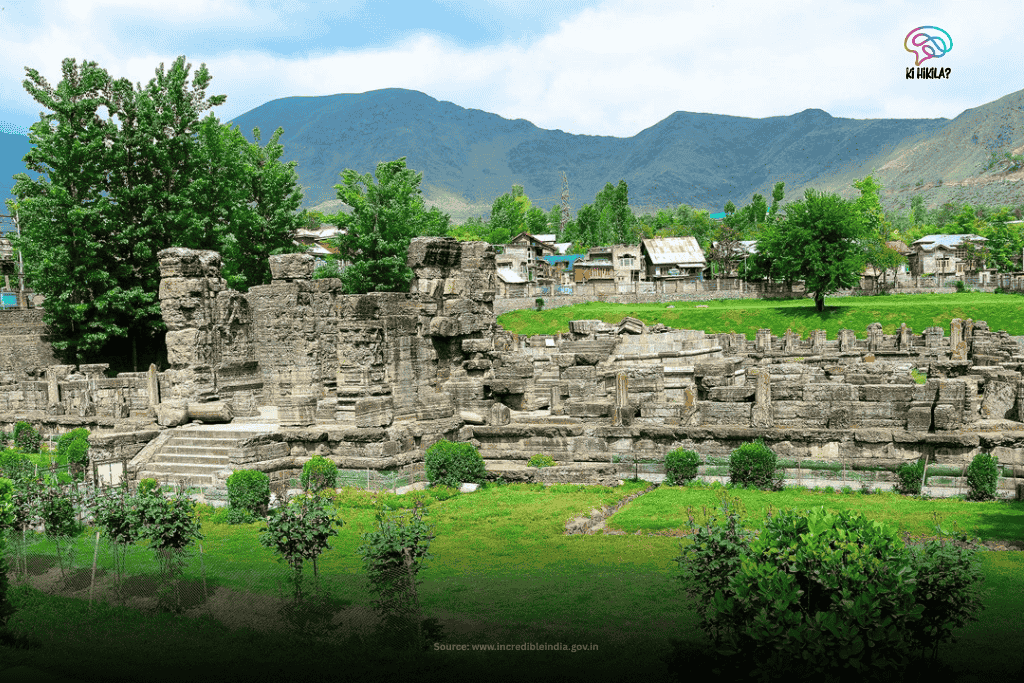 The Fascinating Story of Jammu and Kashmir: History Before 1947, Unique Climate, Tourism, Economy & Culture The ancient stone ruins of Avantiswamin Temple stand amidst lush green lawns and trees, with mountains in the background, in Jammu and Kashmir.