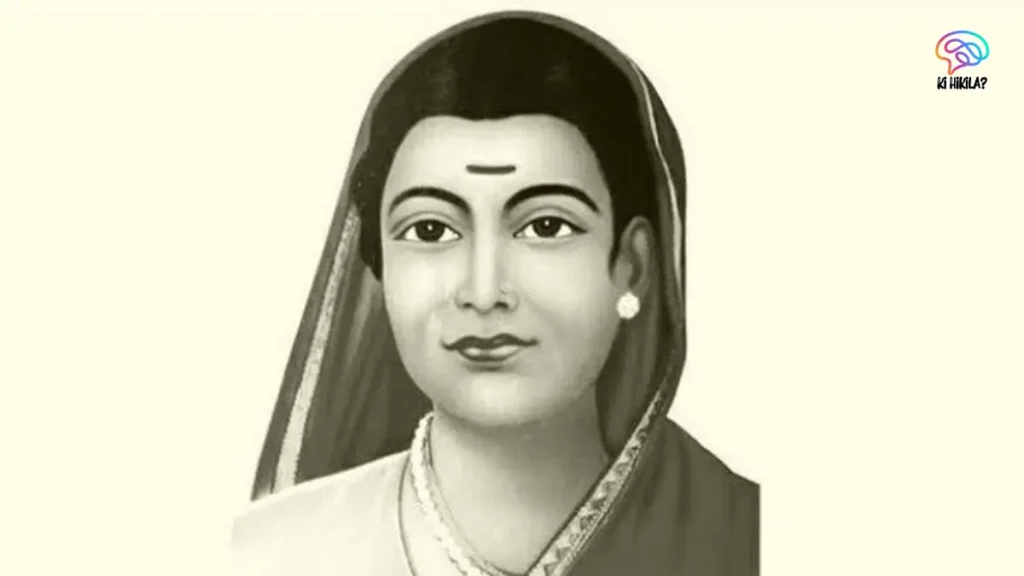 A black and white portrait of Savitribai Phule, a pioneer of women's education in India, with a calm expression.