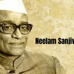 A black and white portrait of Neelam Sanjiva Reddy, the sixth President of India, wearing glasses and a Gandhi cap.