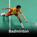 A male badminton player in a yellow and red jersey lunging low on a green court, representing Badminton in Olympic.