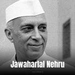 Jawaharlal Nehru: A black-and-white photograph of a man in a suit and rose, speaking at a podium with a microphone.