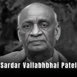 Sardar Vallabhbhai Patel: A historic black-and-white photo of a man in a turban and coat, standing with a resolute expression.