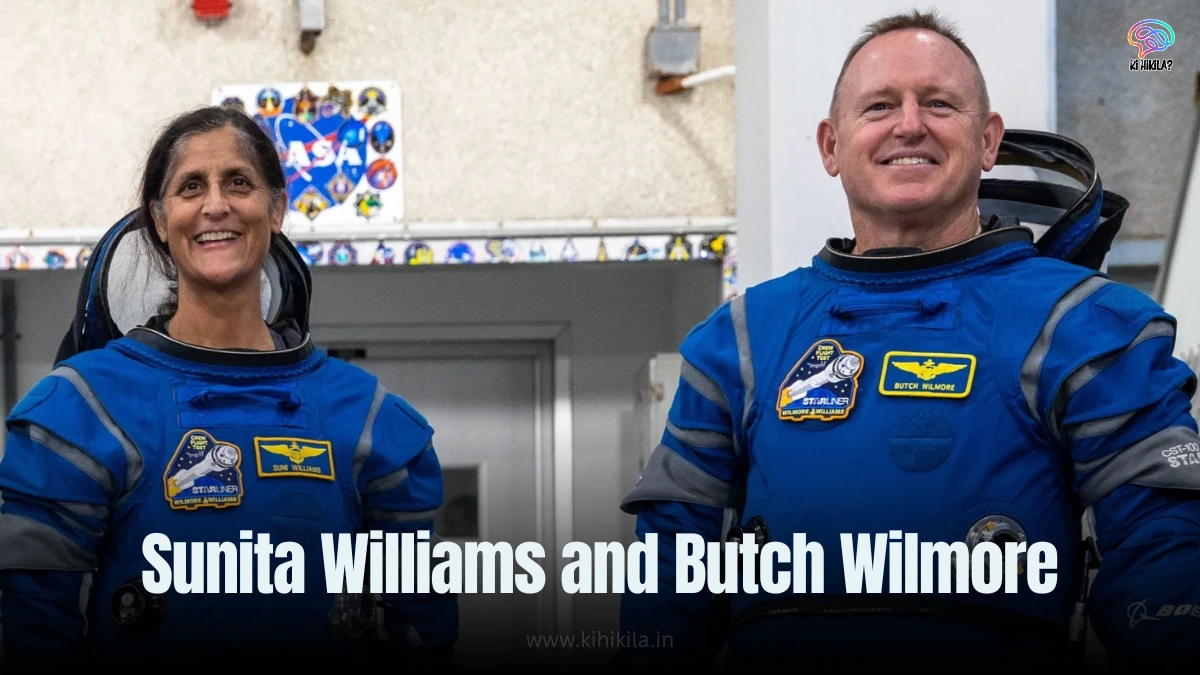 Sunita Williams and Butch Wilmore in white spacesuits smiling and holding orange roses, standing together before their space mission launch.