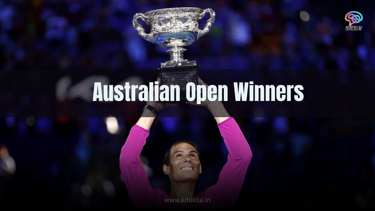 Ultimate List of Australian Open Winners: A jubilant tennis player in a pink shirt raising a silver trophy with both hands, smiling against a blurred blue-lit crowd background.